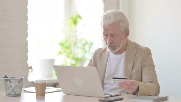 Old Man Making Successful Online Payment on Laptop