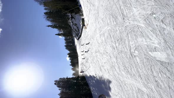 Skier Skiing Downhill in Winter Resort Mountains