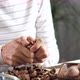 Young Woman Is Cracking a Walnuts at Domestic Room - VideoHive Item for Sale