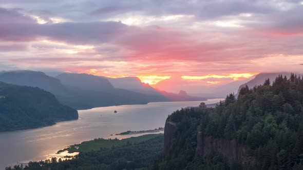 Breathtaking and spectacular sunrise in the Columbia River Gorge with Vista House in the distance