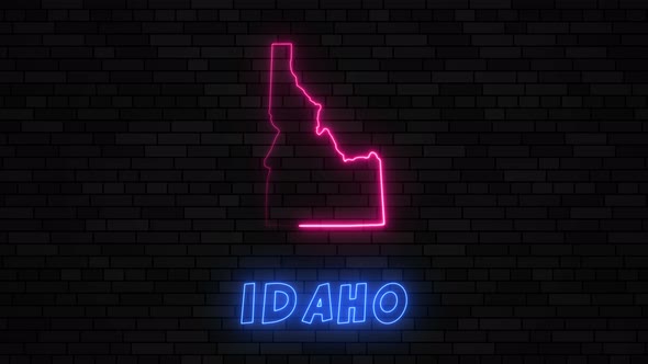 State of Idaho map silhouette with neon line on a dark brick wall background