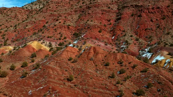 Aerial view of orange and yellow rock formations in vermillion cliffs utah outside kanab.