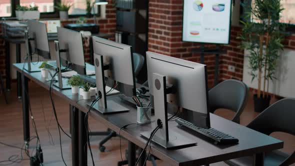 Empty Call Center Office with Computers and Monitors on Desk