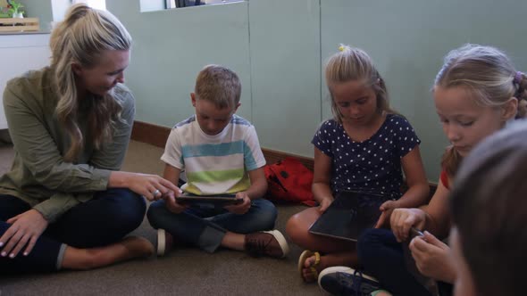 Group of kids using digital tablet in the class