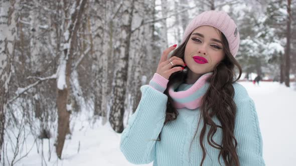 Beautiful Woman in Snowy Countryside