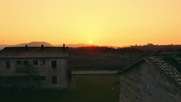 Sunset over the Houses in the Mountains