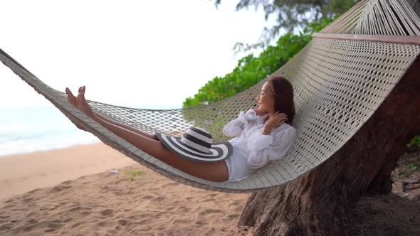 Asian woman enjoy around beautiful beach sea ocean