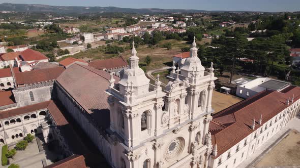 Baroque style towers of Alcobaca Monastery, Catholic monastic complex. Aerial orbiting shot