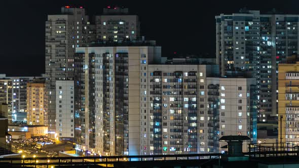 night city, residential buildings, light in the windows