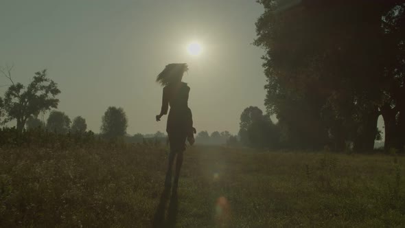 Joyful Pretty Black Female in Summer Dress Enjoying Scenic Nature at Dawn