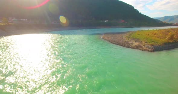 Low Altitude Flight Over Fresh Fast Mountain River with Rocks at Sunny Summer Morning