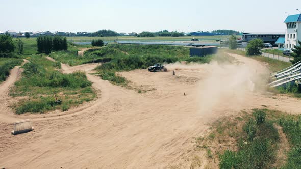 A Cart is Racing Along the Outdoor Track