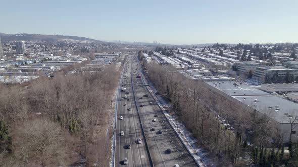 aerial view of Vancouver Canada main road highway with traffic car and truck, drone controlling traf