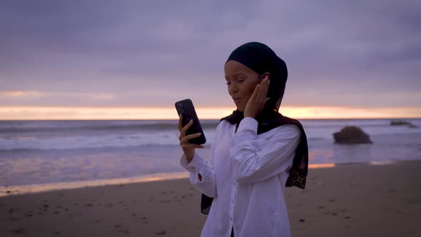 Somali-American woman checking her social media