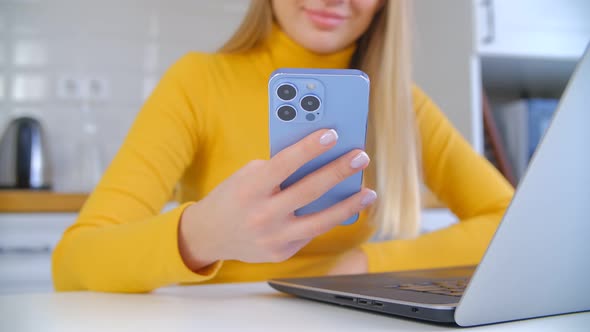 Cheerful white blonde girl browsing internet on modern smartphone in 4k stock video