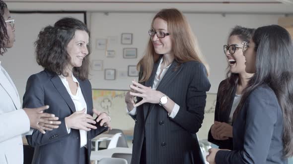 Cheerful Businesswomen Talking in Office