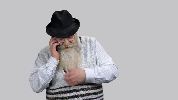 Old Retired Aged Man Having Phone Conversation and Smiling