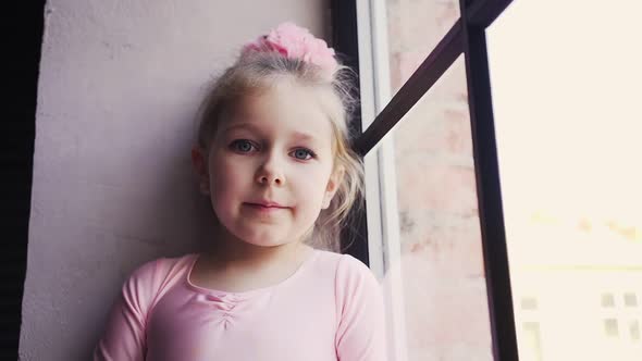 Portrait Little Cute Baby Girls in Pink Dress and Bow on Head