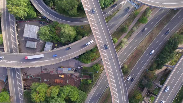 Vehicles Driving on a Spaghetti Interchange Bird's Eye Aerial View