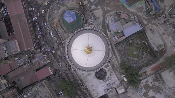 Flying over the Dharahara Tower looking down at it while spinning