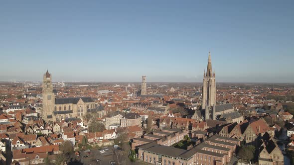 Establishing drone shot of the city of Bruges in Belgium on a nice sunny day