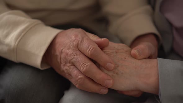 Senior Old Couple Husband and Wife Holding Hands Close Up View Mature Elderly Family Grandparents