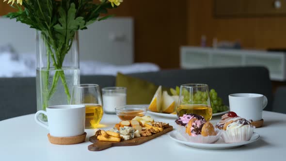 breakfast with flowers on the table in the bedroom