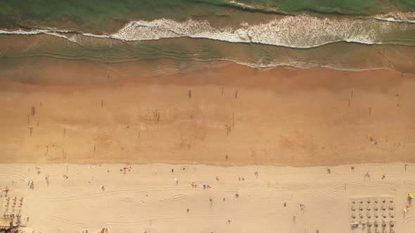 Aerial View of a Minimalist Symmetric Beach and Waves