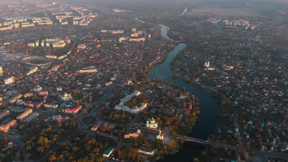Aerial Panoramic Shot of Small European City Placed on River Banks, Drone Flying High