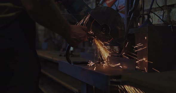 Master is Cutting Metallic Detail By Circular Saw Close Up View in Repair Workshop  Prores