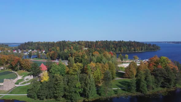 Aluksne Lake  Island Pilssala With Park and Castle Ruins in Latvia. Autumn Aerial 4K Landscape Shot