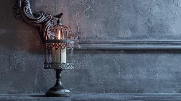 Mystical Halloween still-life background. Skull, candlestick with candles, old fireplace.