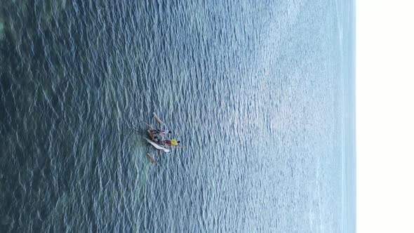 Tanzania Vertical Video  Boat Boats in the Ocean Near the Coast of Zanzibar Aerial View