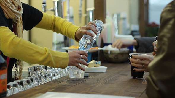 Serving Sparkling Water at Bar