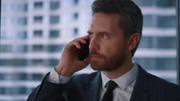 Serious Adult Boss Businessman Talking Phone Calling Mobile in Modern Office