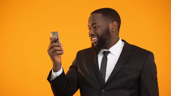 Satisfied With Mobile Application Performance Black Male Showing Thumbs-Up