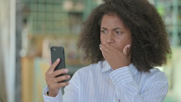 Portrait of African Businesswoman Having Loss on Smartphone