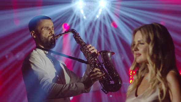 Musical Band Group of Three People Playing Music Song Performing on Concert Musician Light Stage