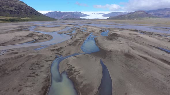 Flying Above a Glacial River Transporting Deposits from Vatnajokull Glacier in Iceland