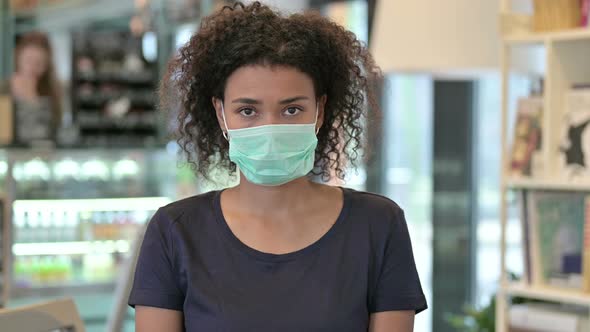 Portrait of Young African Woman with Face Mask 