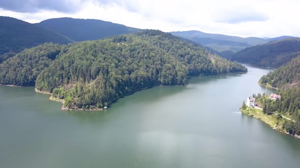 Aerial Drone Shot Pulling Back Revealing a Huge Seaside Dam.