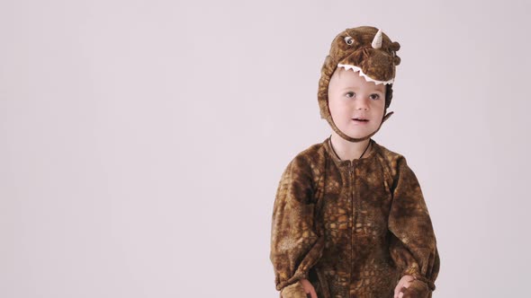 Little Boy in Dragon Costume on Halloween Party