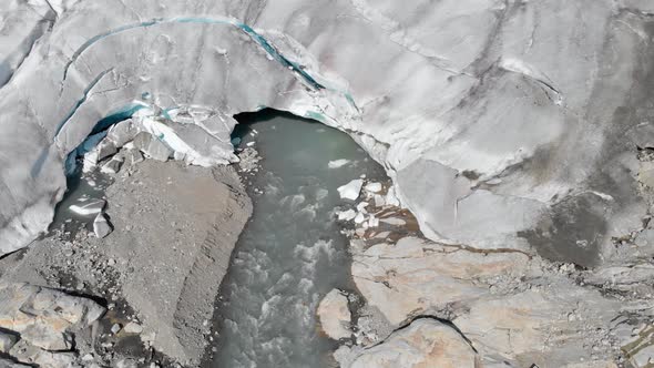 Glacier ice sheet melting and breaking, global warming, aerial 4K view