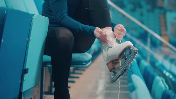 Close Up of an Ice Skating Shoe Getting Laced Up