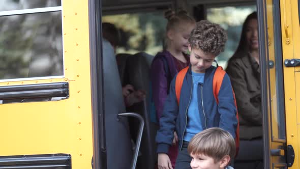 Little Pupils Saying Goodbye To School Bus Driver