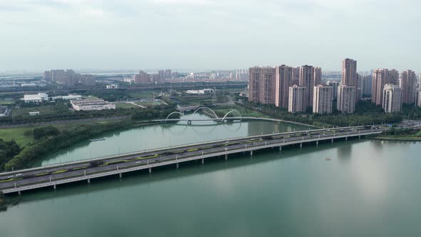 Aerial of the cars passing over the bridge.