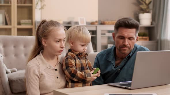 Family with Toddler Using Laptop