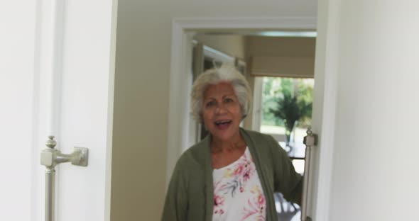 Portrait of smiling senior african american woman looking at camera and talking