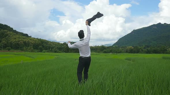 Excited Businessman On Rice Fields