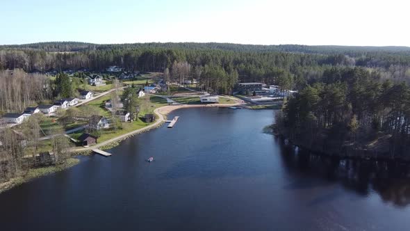 Aerial View of the Lake Borisovskoye, the Forest and the Settlement in Autumn Day, Borisovo